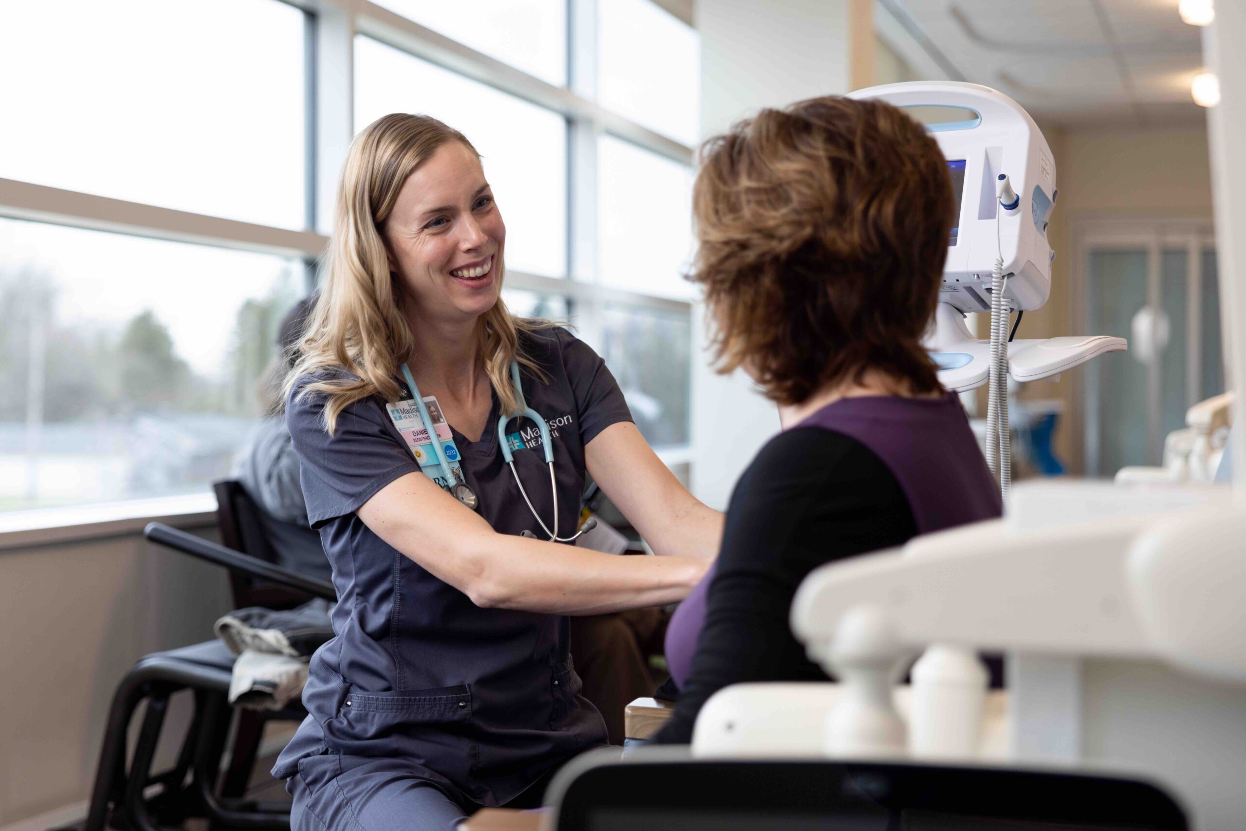 Madison Health Cancer Center nurse smiling at patient