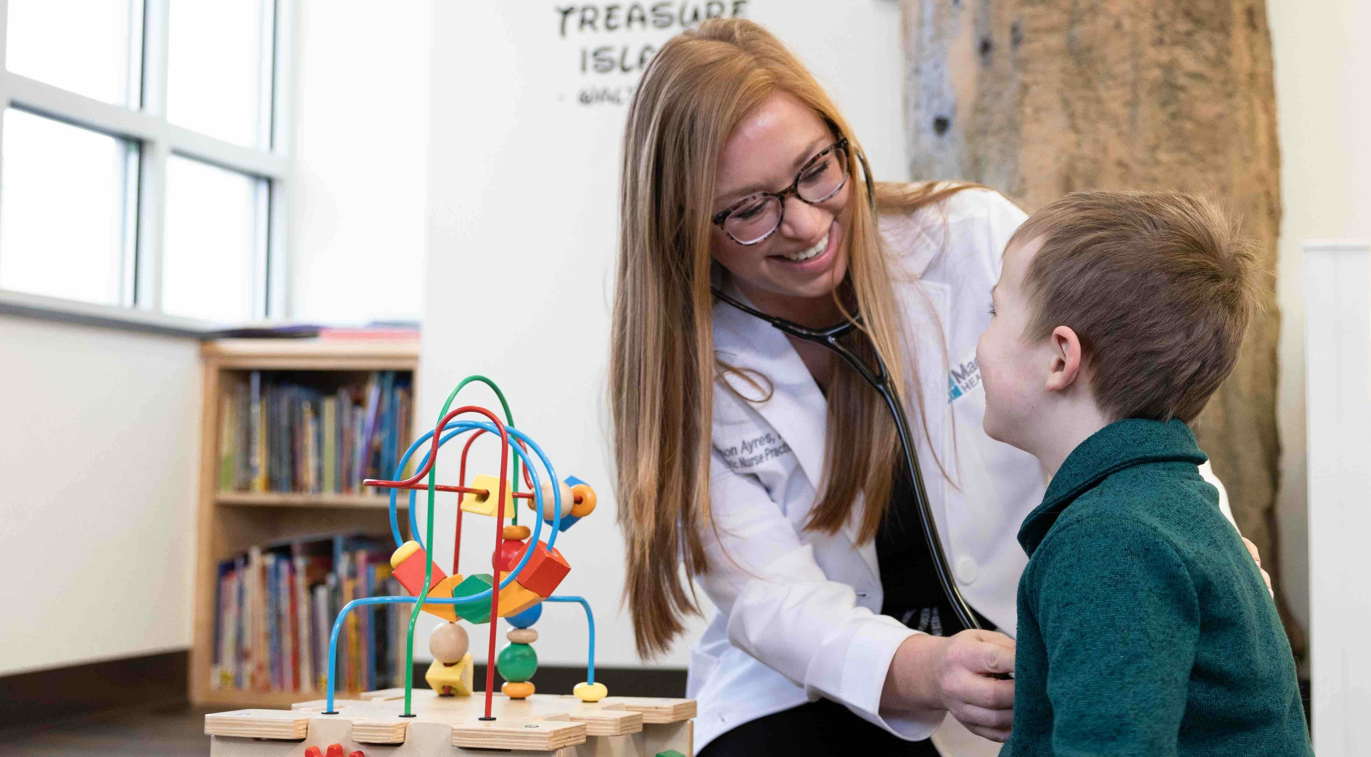 Madison Health Pediatrics provider listening to child's heart